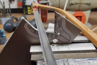 Sawing with the metal handsaw Sawing with the metal handsaw