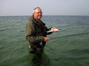 The fish is small, the smile is big The fish is small, the smile is big