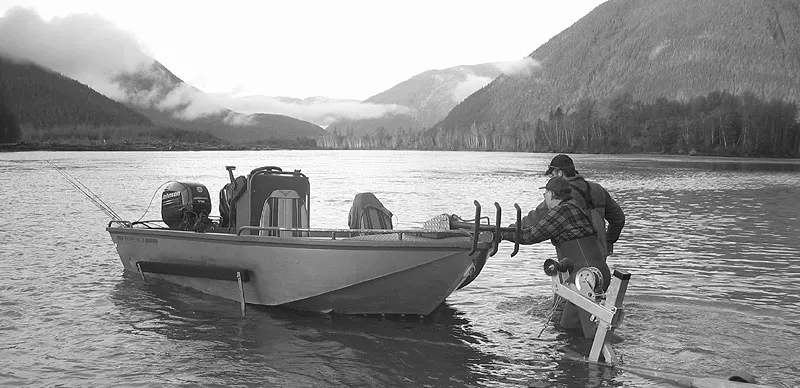 Boat launch - Fellow angler Ken from Vancouver and our guide Gill McKean from the <a style="color : #ffffff;" href="http://www.westcoastfishing.ca/index.htm">Westcoast Fishing Adventures</a> launching the boat into the Mighty Skeena.
